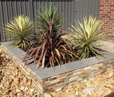 Planter box, with stack stone and pavers on top